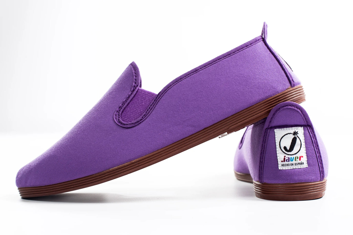 Javer Purple slip-on shoes with brown soles on a white background