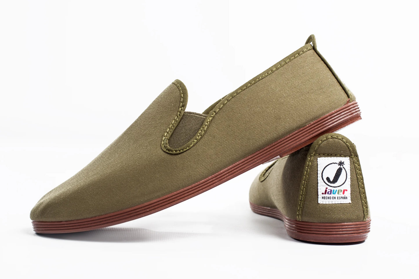 Javer Pair of olive green slip-on shoes with red soles on a white background