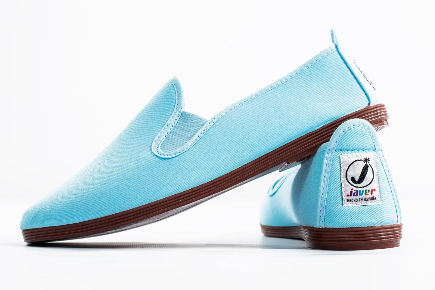 Javer Light blue loafers with brown soles on a white background