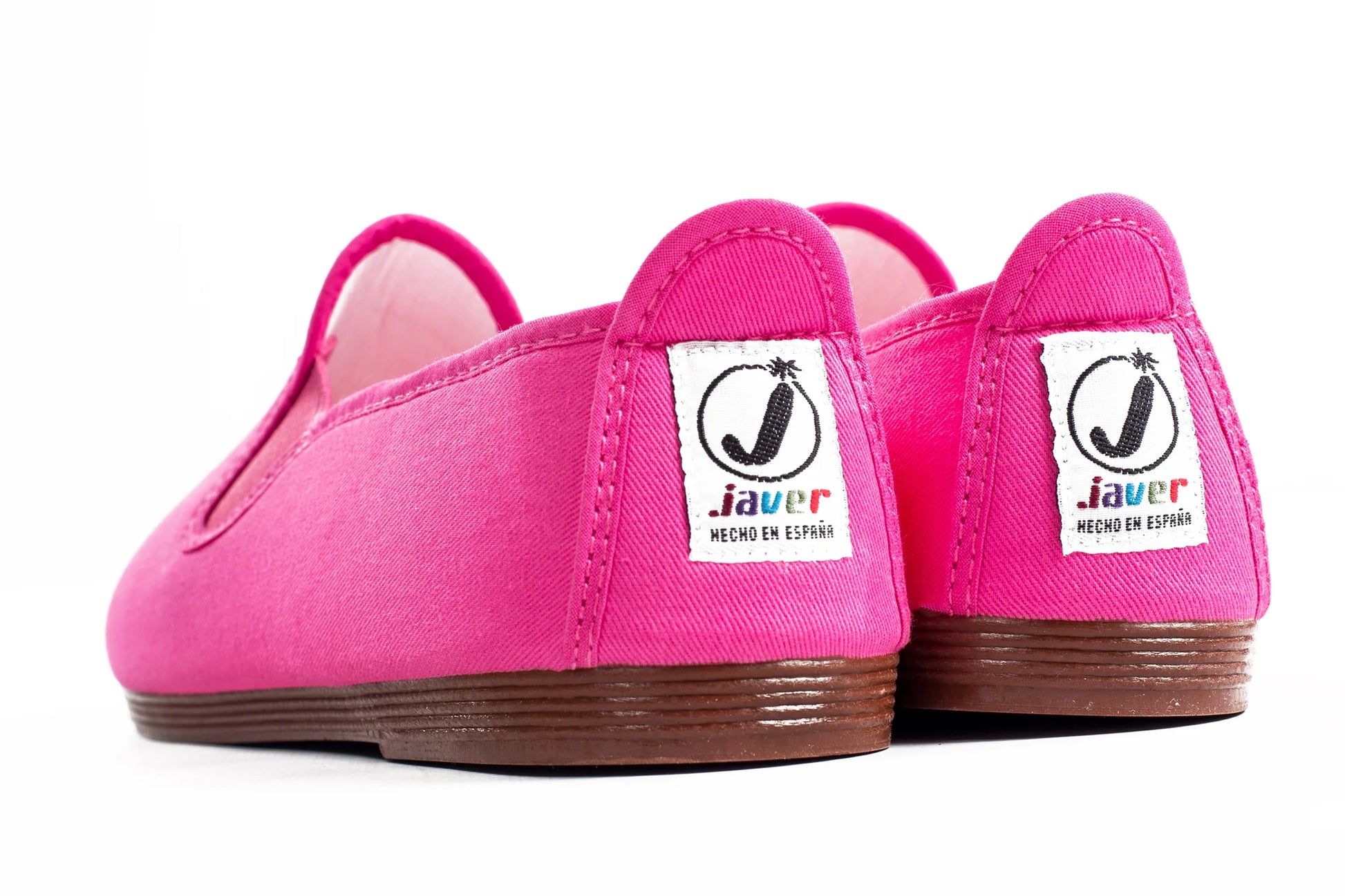 Javer Pair of pink slip-on shoes with 'Javer' branding on a white background
