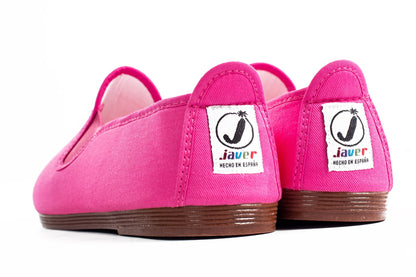 Javer Pair of pink slip-on shoes with 'Javer' branding on a white background
