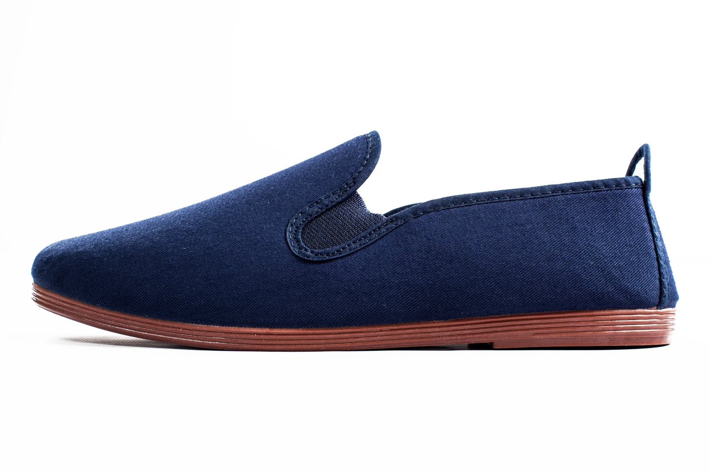 Javer Navy blue slip-on shoe with brown sole on a white background