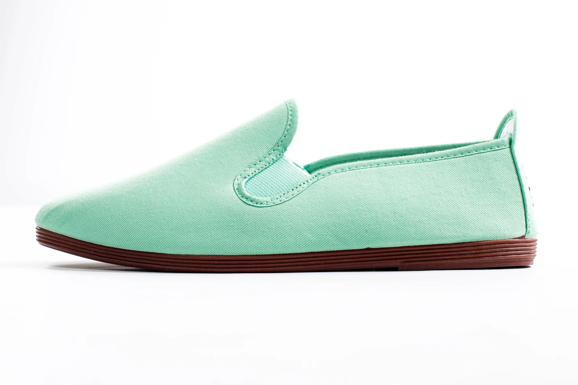 Javer Mint green slip-on shoe with brown sole on a white background