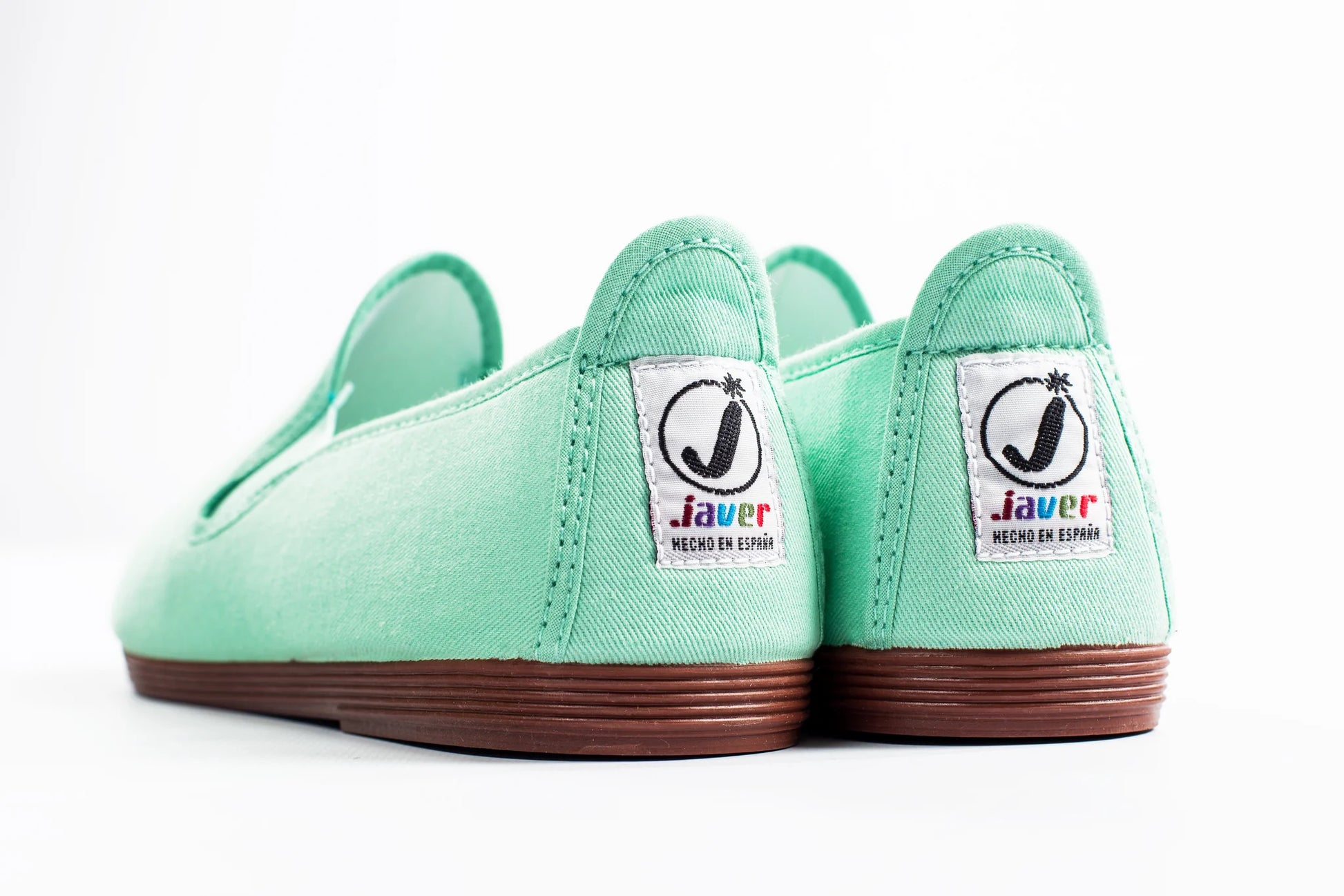 Javer Pair of mint green shoes with 'Javer' branding on a white background