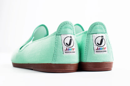 Javer Pair of mint green shoes with 'Javer' branding on a white background