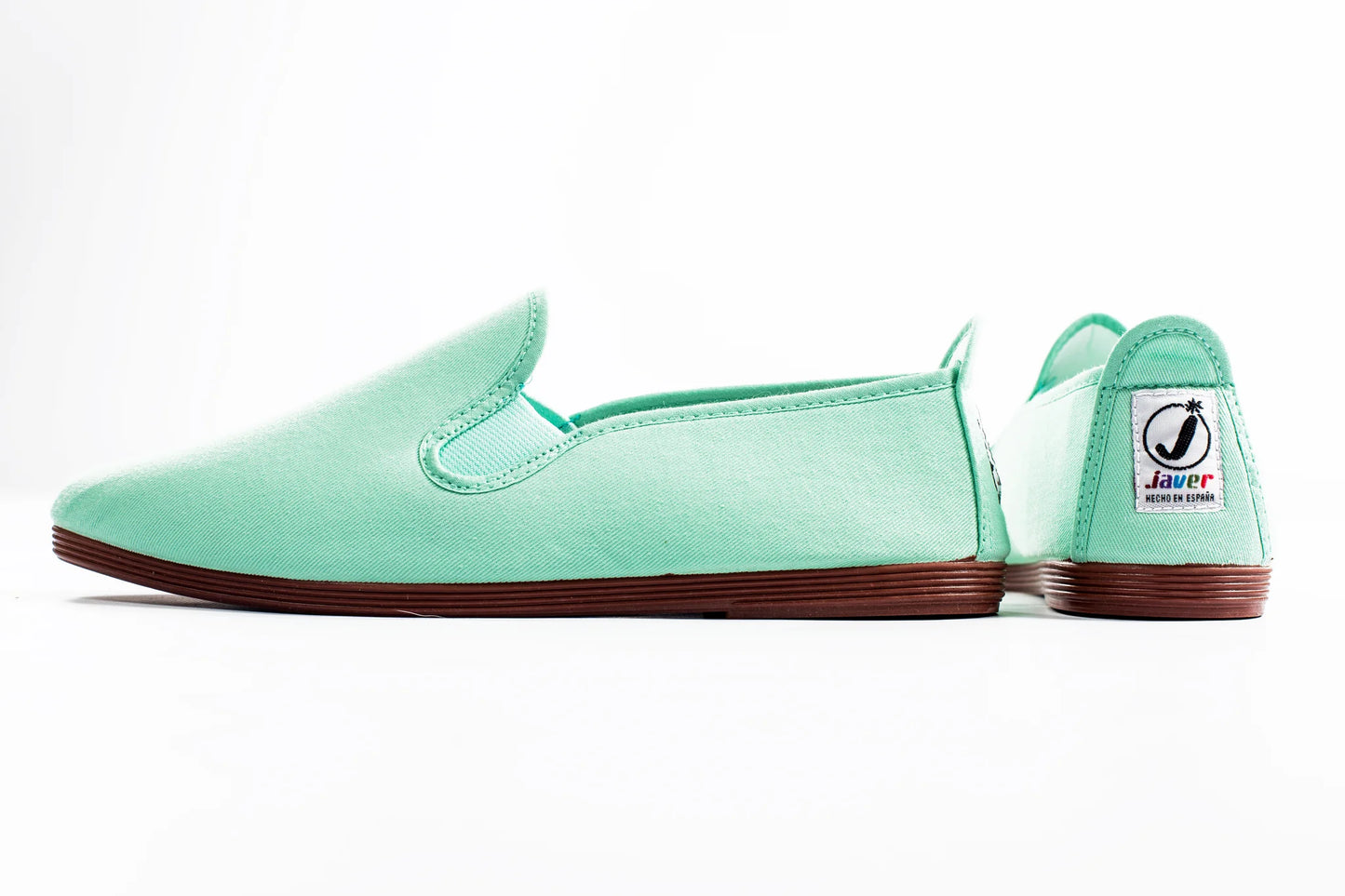 Javer Mint green slip-on shoe with brown sole on a white background