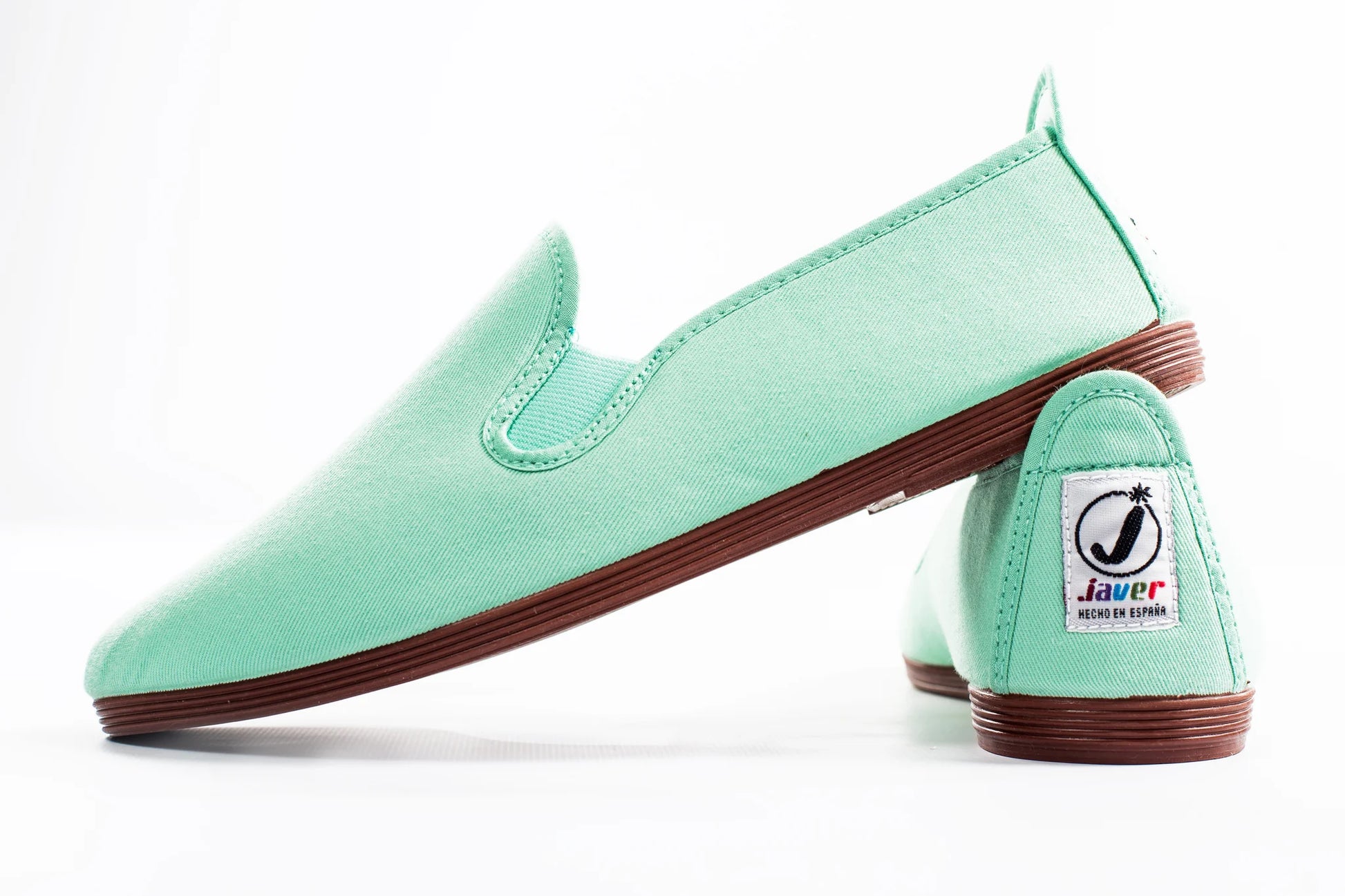 Javer Mint green slip-on shoes with brown soles on a white background