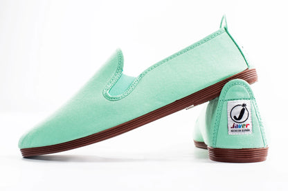 Javer Mint green slip-on shoes with brown soles on a white background