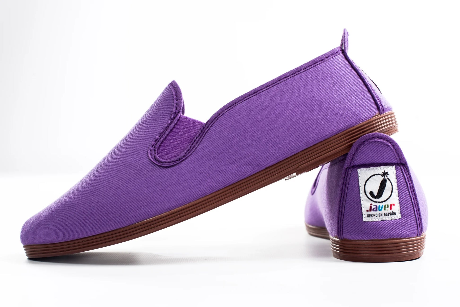 Javer Purple slip-on shoes with brown soles on a white background