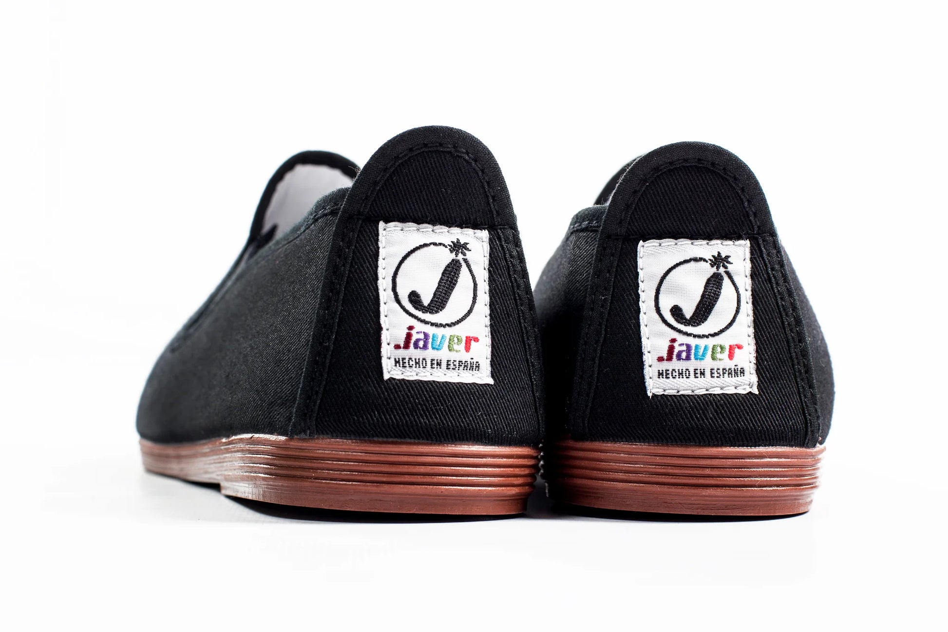 Javer Black shoes with 'Javer' logo on the sole against a white background