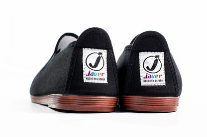 Javer Black shoes with 'Javer' logo on the sole against a white background