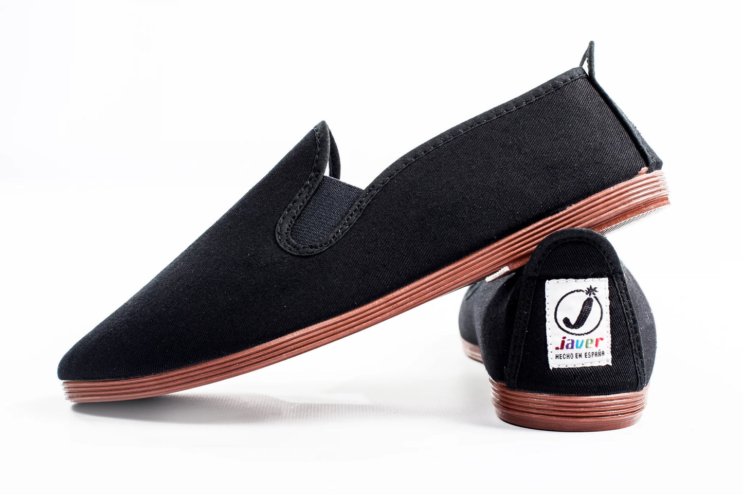 Javer Black loafers with brown soles on a white background, featuring the Javer brand logo.
