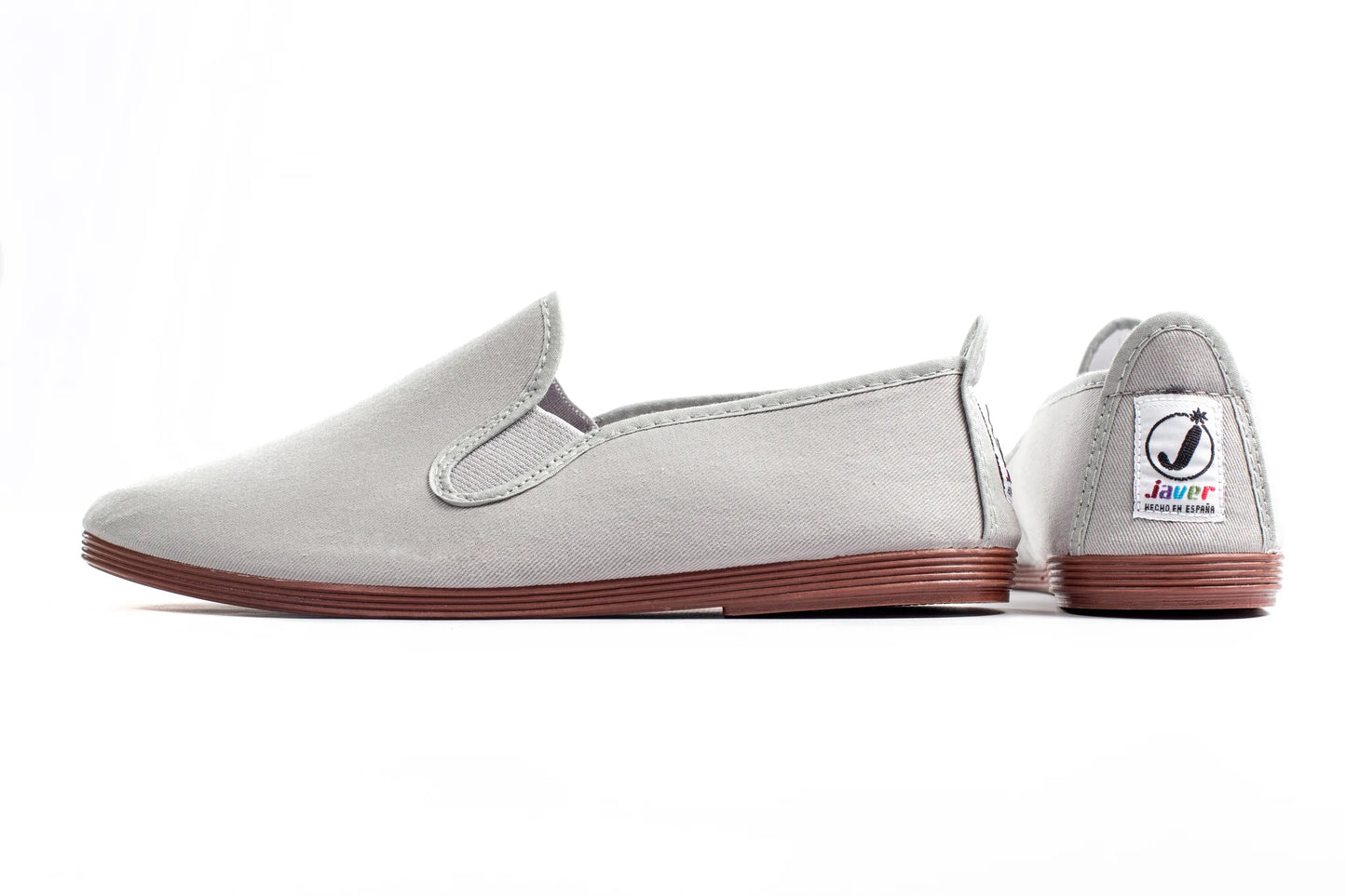 Javer Gray slip-on shoe with brown sole on a white background