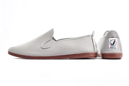 Javer Gray slip-on shoe with brown sole on a white background
