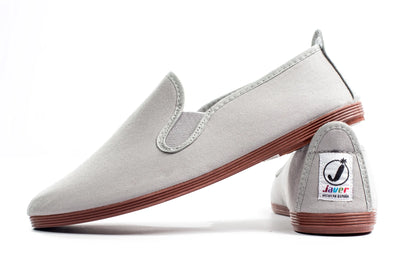 Javer Gray slip-on shoes with red soles on a white background, featuring a visible brand logo.