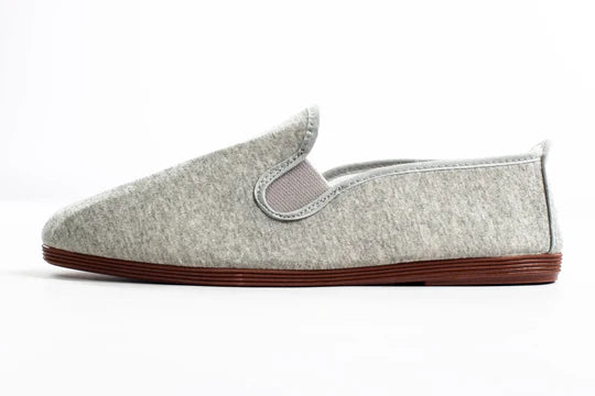 Javer Gray slip-on shoe with brown sole on a white background