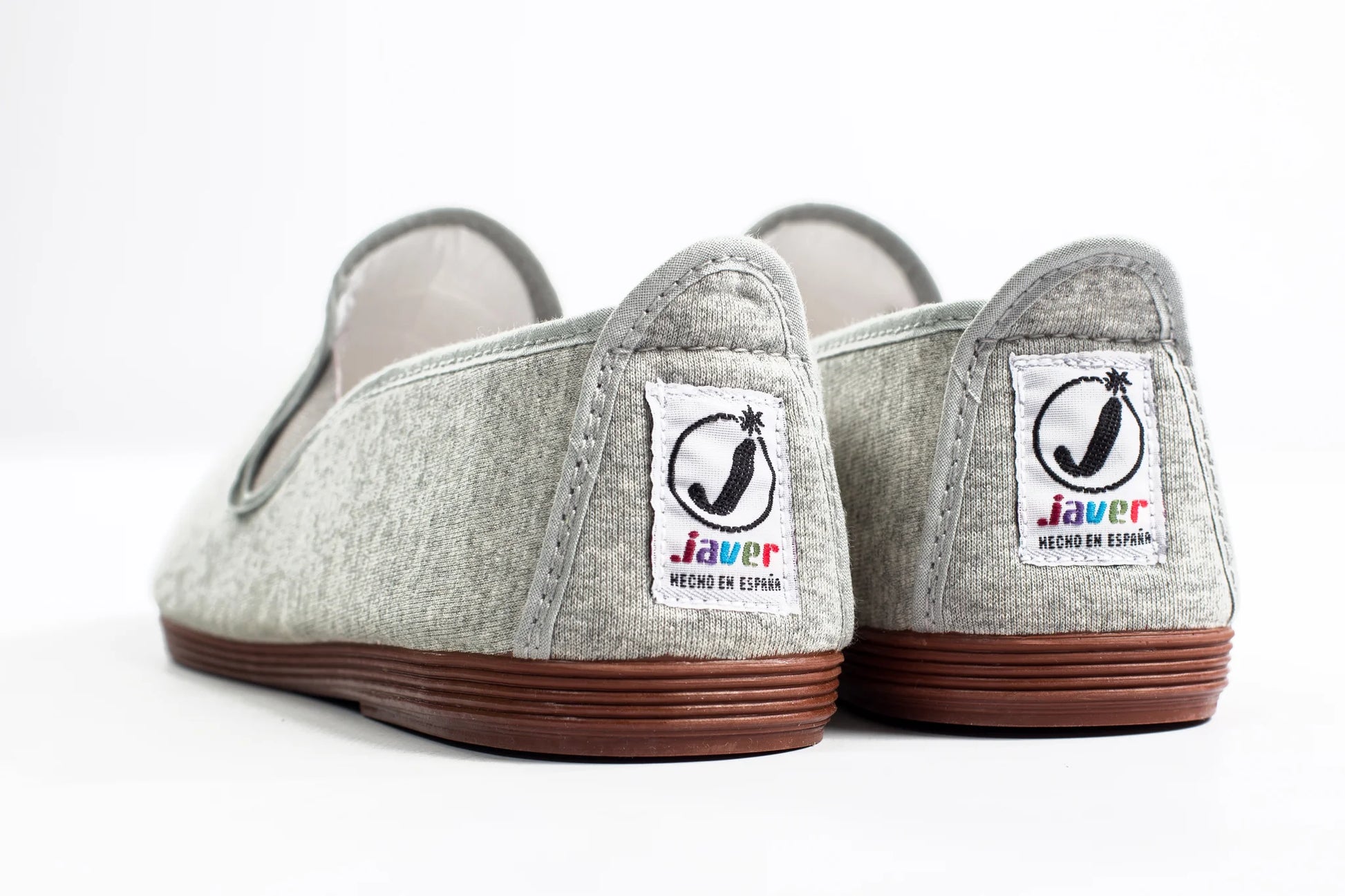 Javer Pair of gray shoes with brown soles on a white background, featuring the Javer logo.