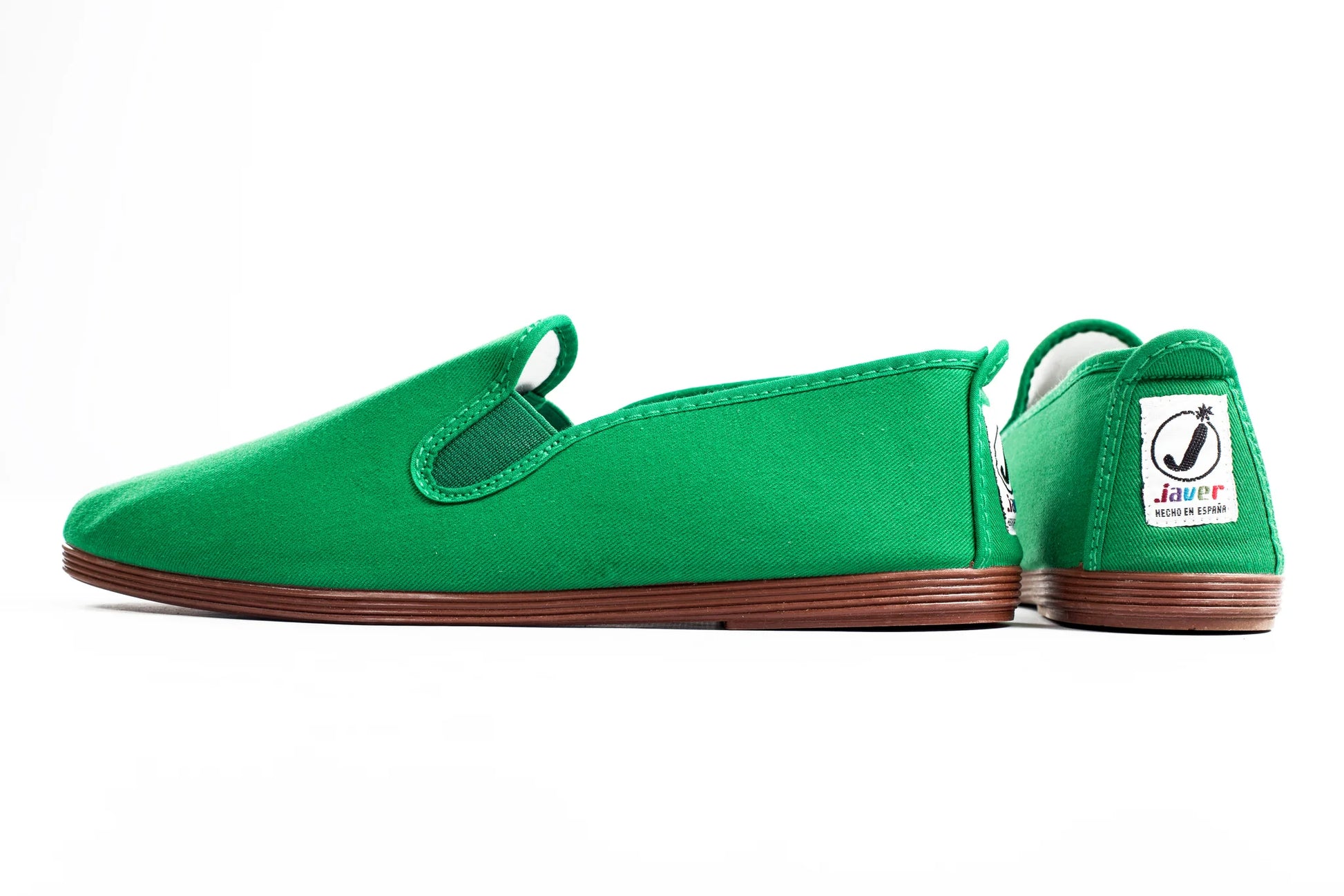 Javer Green slip-on shoe with brown sole on a white background