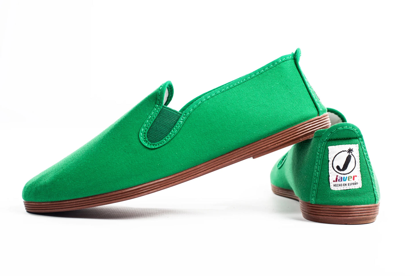 Javer Green slip-on shoes with brown soles on a white background