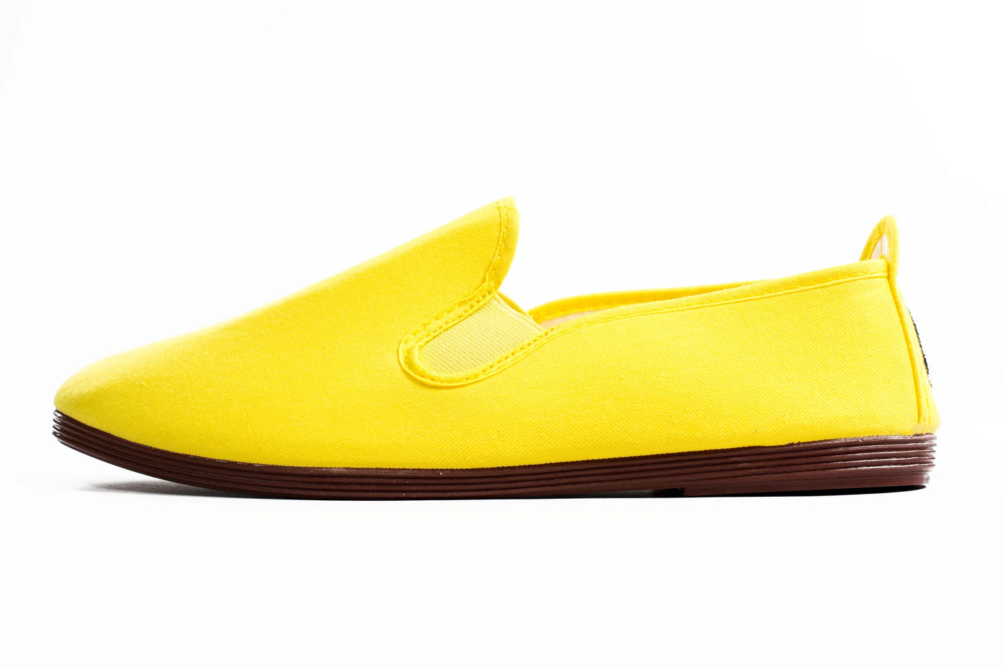 Yellow slip-on shoe on a white background