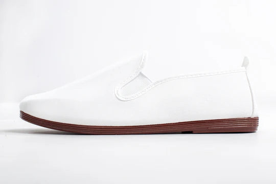 Javer White sneaker with a brown sole on a white background