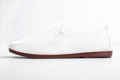Javer White sneaker with a brown sole on a white background