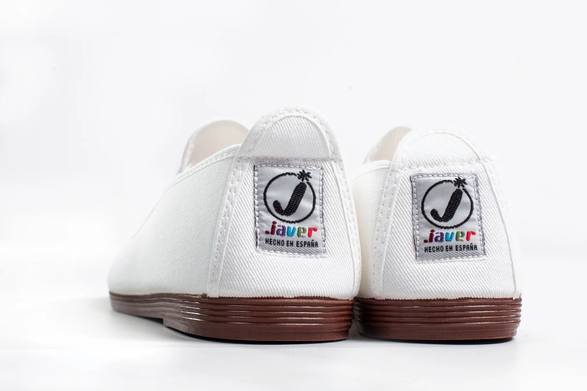 Javer White sneakers with brown soles and 'Javer' logo on a white background